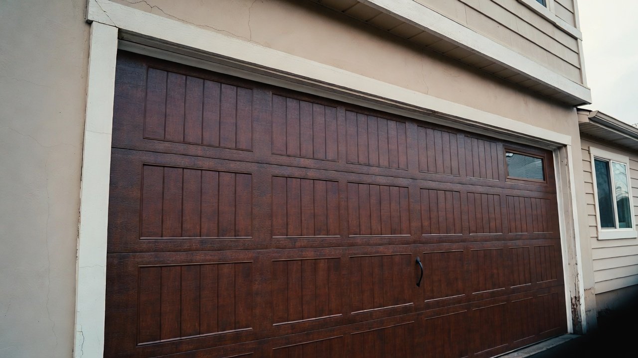 Residential garage door repair technician